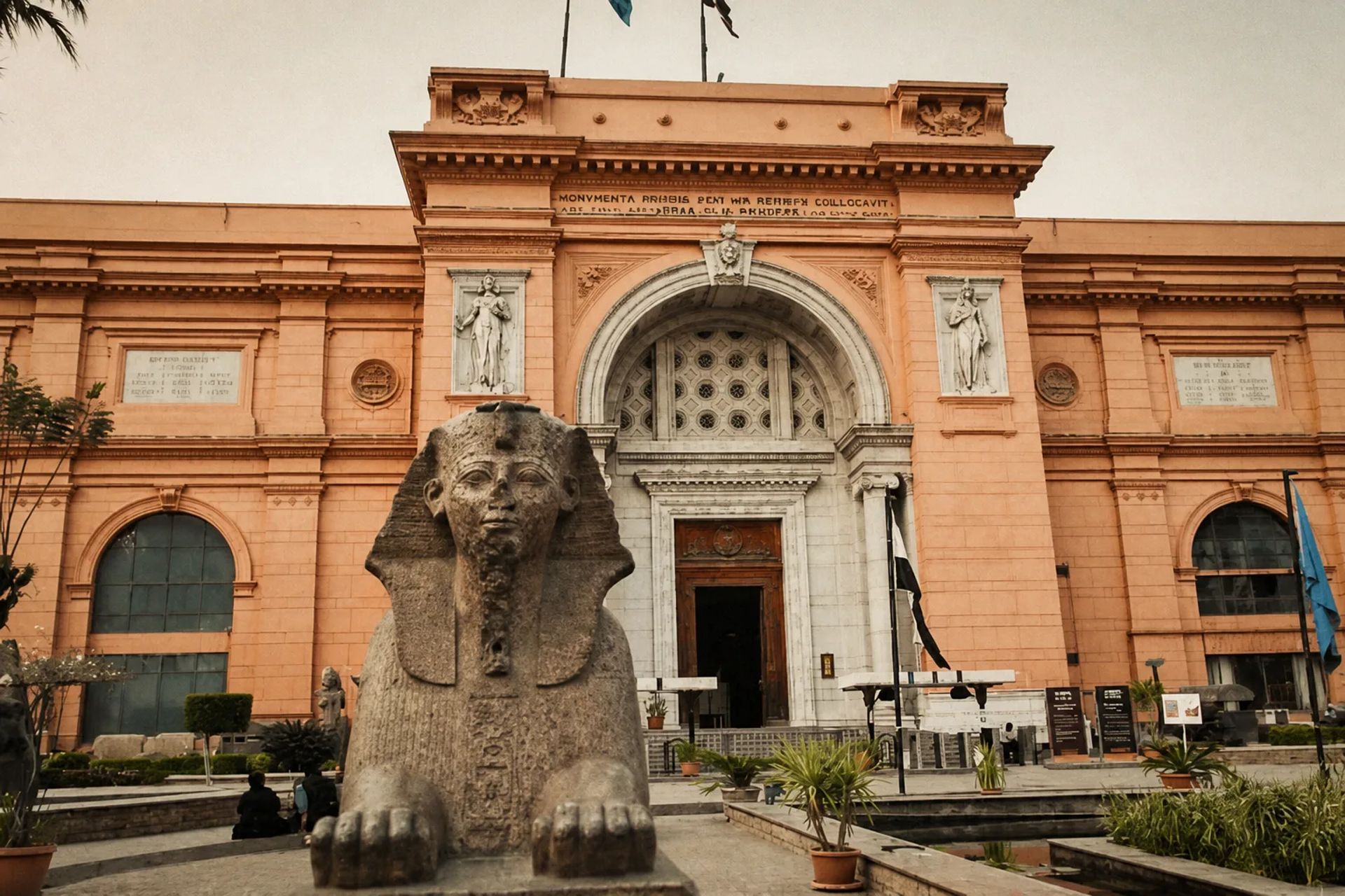 A gallery of pharaonic statuary lit in a Cairo museum hall