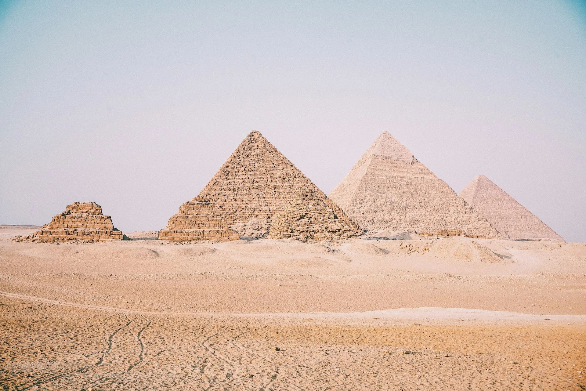The Pyramids of Giza on the western edge of Cairo at golden hour